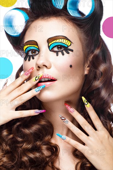 Photo of surprised young woman with professional comic pop art make-up and design manicure. Creative beauty style and nails. Photos shot in studio