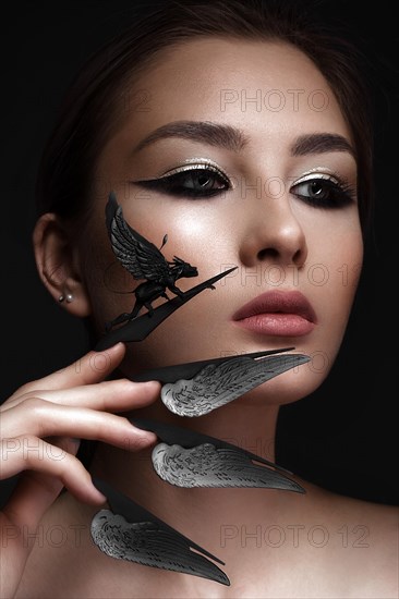 Beautiful woman with art make-up