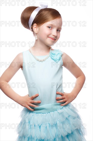 A little girl in a blue dress