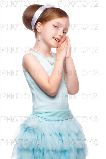 A little girl in a blue dress