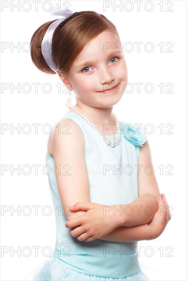 A little girl in a blue dress