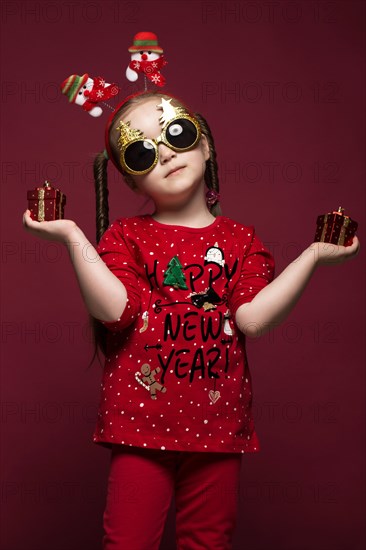 Funny little girl in the New Year's image