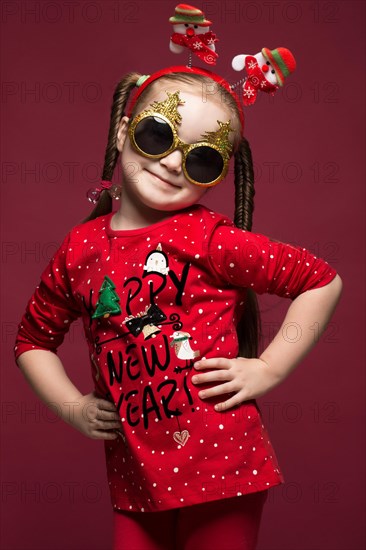 Funny little girl in the New Year's image