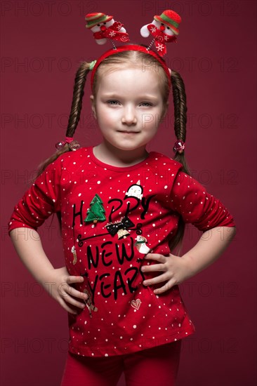 Funny little girl in the New Year's image