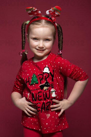 Funny little girl in the New Year's image