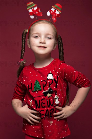 Funny little girl in the New Year's image