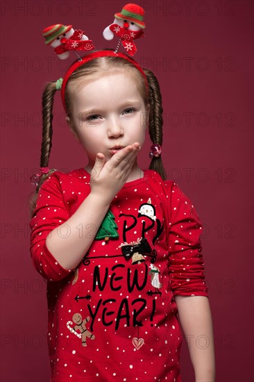 Funny little girl in the New Year's image