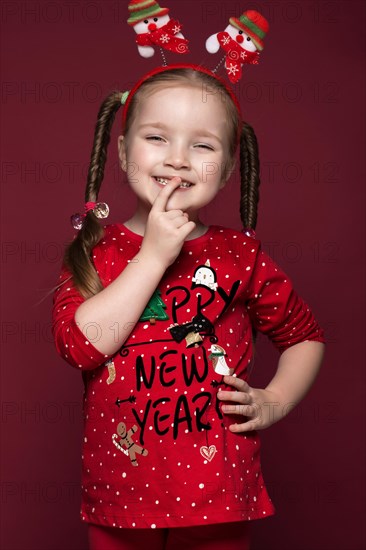 Funny little girl in the New Year's image