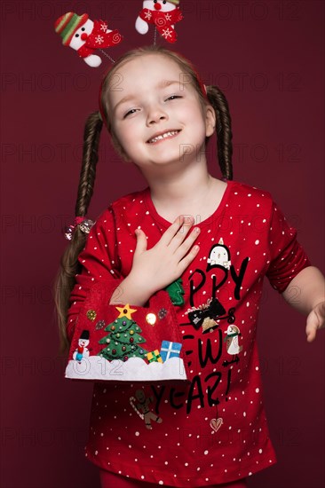 Funny little girl in the New Year's image