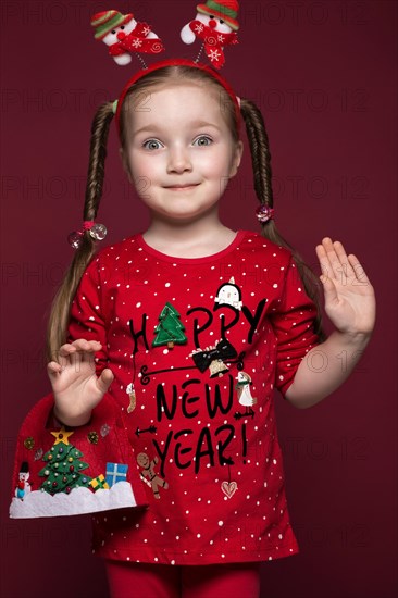 Funny little girl in the New Year's image