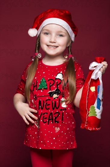 Funny little girl in the New Year's image