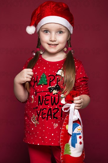 Funny little girl in the New Year's image