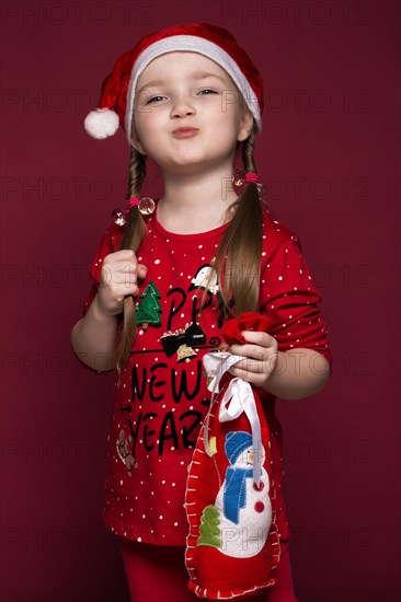 Funny little girl in the New Year's image