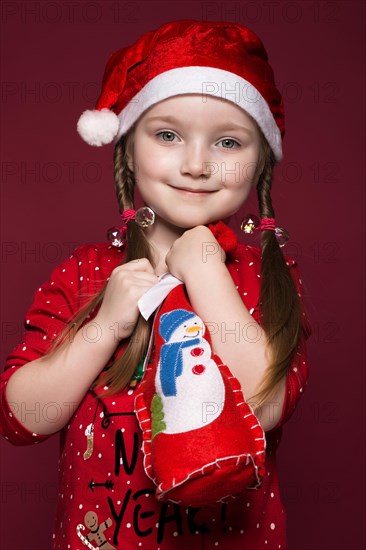 Funny little girl in the New Year's image