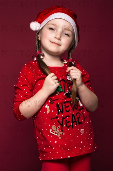 Funny little girl in the New Year's image