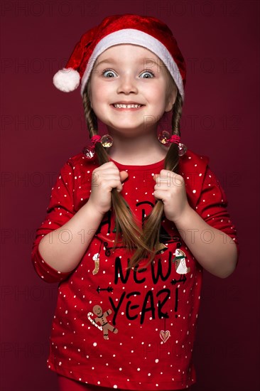 Funny little girl in the New Year's image