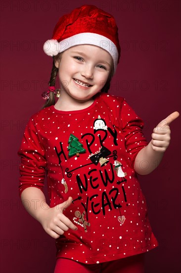 Funny little girl in the New Year's image