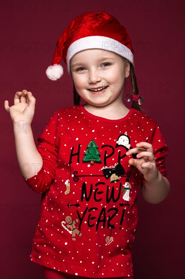 Funny little girl in the New Year's image