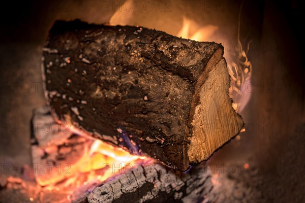 Burning log in the fireplace