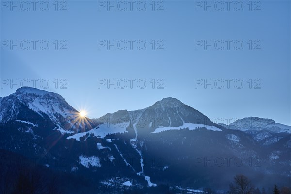 Mountain range Hoher Goell and Jenner mountain with sun in winter