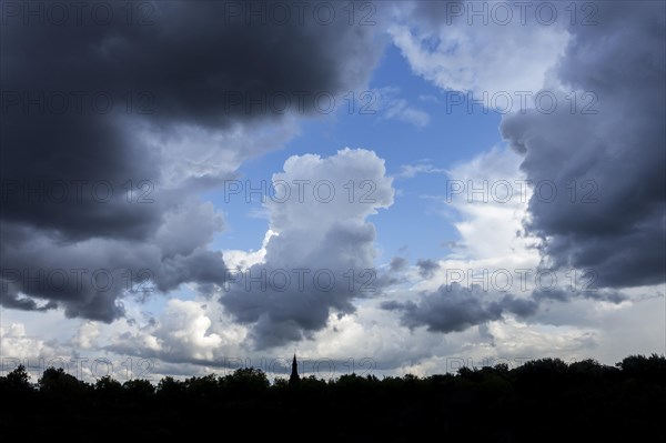 Gap in white and grey clouds