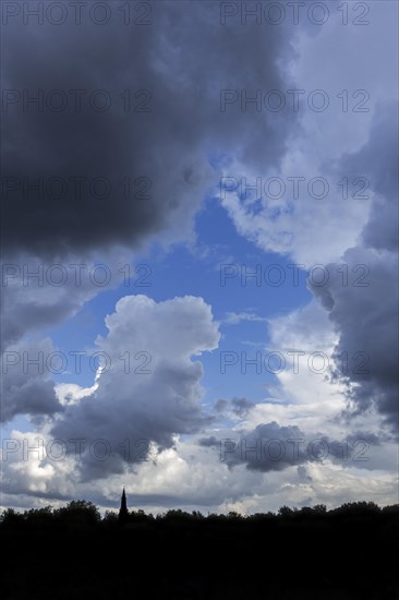 Gap in white and grey clouds