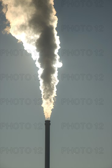 Smoking chimney of a modern biomass-fuelled combined heat and power plant