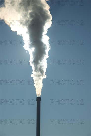 Smoking chimney of a modern biomass-fuelled combined heat and power plant