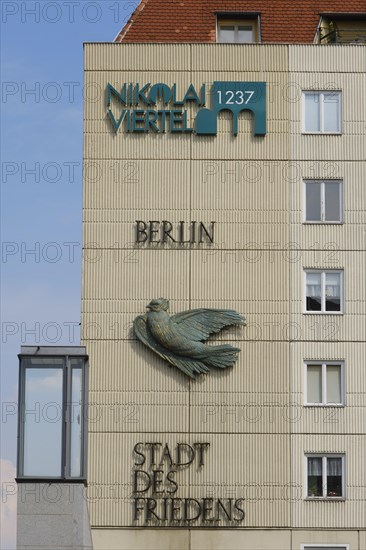 House facade with dove and lettering City of Peace