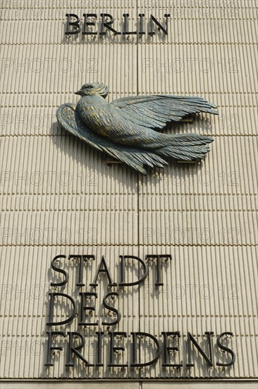 House facade with dove and lettering City of Peace