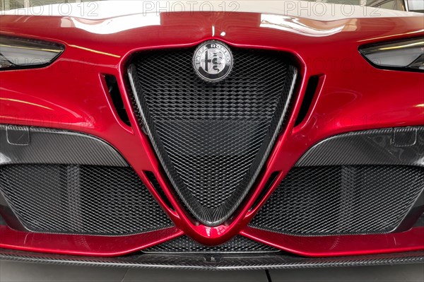 Details of front with black and white logo radiator grille Scudetto of limited to 500 pieces Italian sports car Alfa Romeo Giulia GTAm