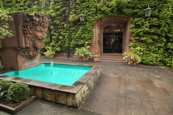 Entrance with Bacchus fountain figure from restaurant Kupferberg Terrace