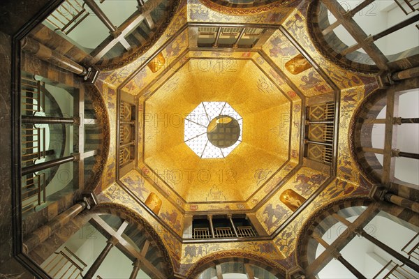 View up to the ceiling with mirror in the foyer