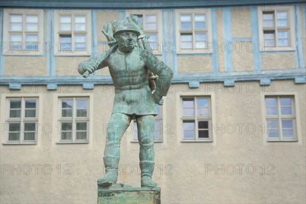 Sculpture by Bernhard Frydag 1914 at the wooden beam fountain