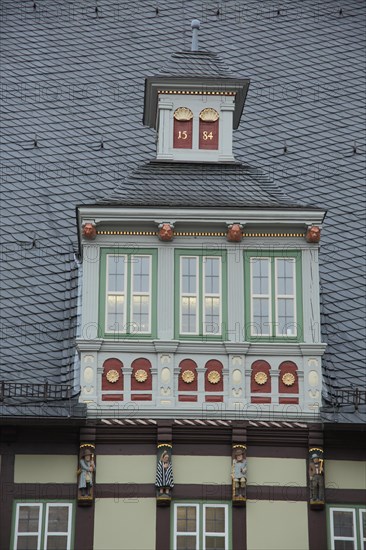 Dormer with figures on the roof of the town hall