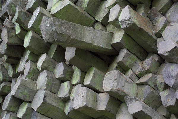 Basalt stone wall with basalt prisms