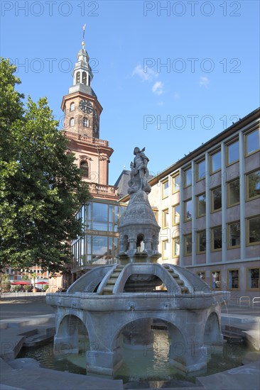 Siegfried Fountain on the Market Square and Tower of Holy Trinity Church