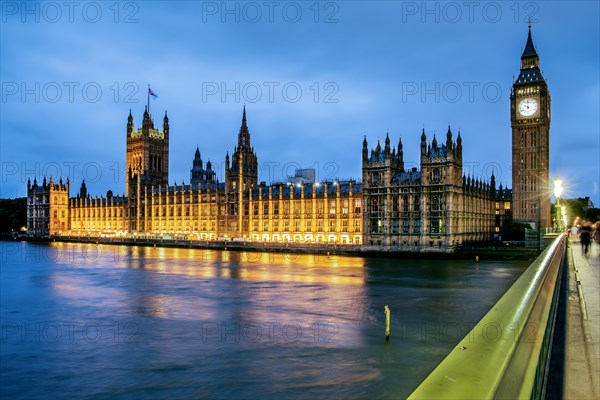 Thames Embankment with the Houses of Parliament and the clock tower Big Ben at dusk