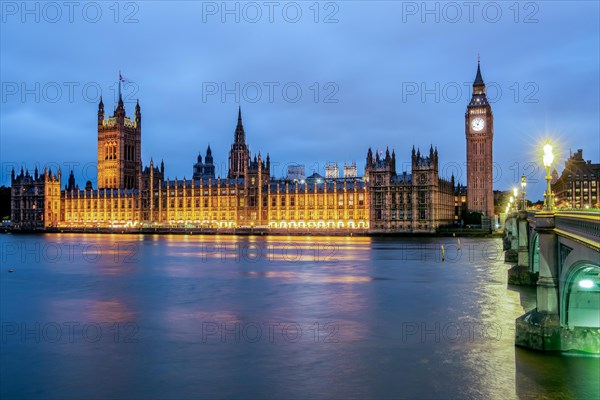 Thames Embankment with the Houses of Parliament and the clock tower Big Ben at dusk