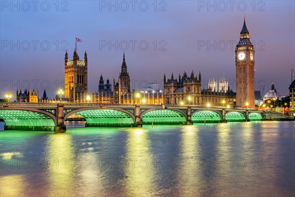 Westminster Bridge over the Thames with the Houses of Parliament and the clock tower Big Ben at dusk