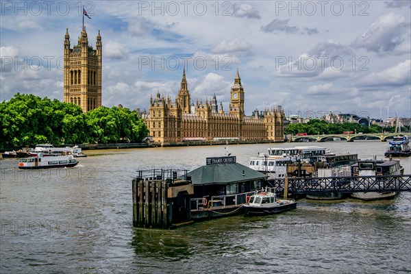 Excursion boat on the Thames with Parliament House and Victoria Tower