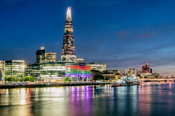 Thames Embankment with The Shard skyscraper at night