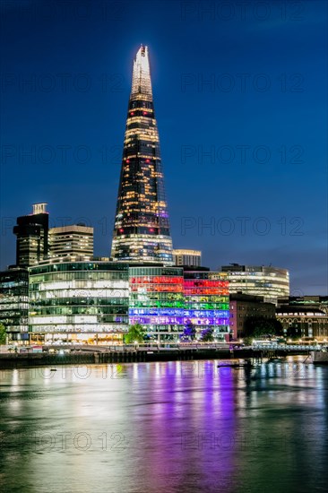 Thames Embankment with The Shard skyscraper at night