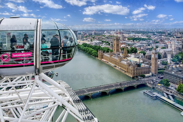 Gondola from the London Eye Ferris Wheel over the Thames with the Houses of Parliament