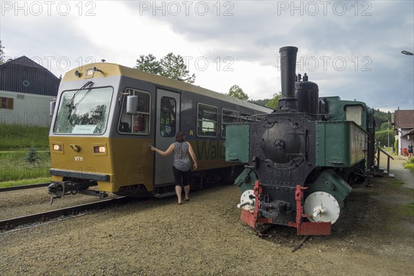 Modern set of the Waldviertelbahn and steam locomotive at the station of