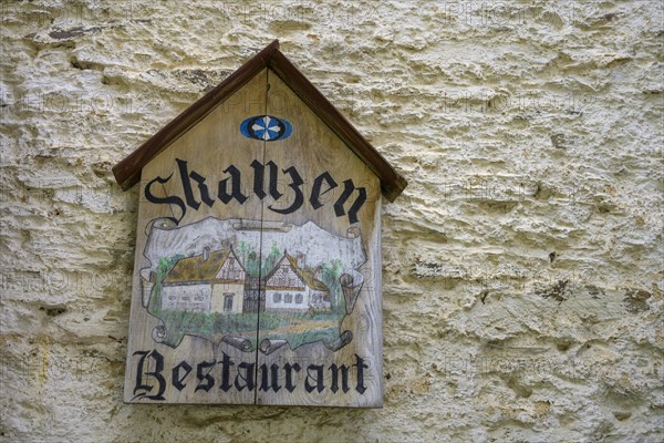 Sign of the Skanzen restaurant in the museum village with Egerland half-timbered houses