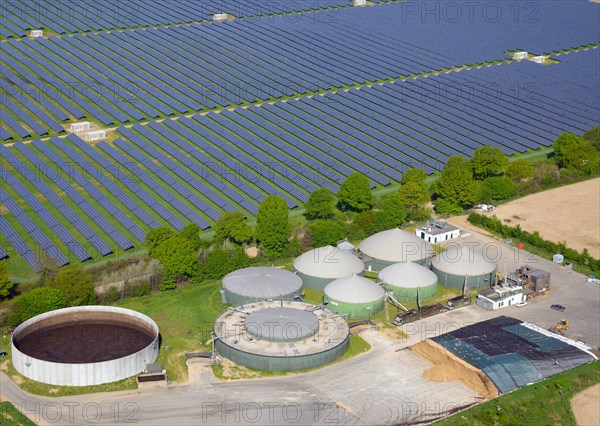 Aerial view of a biogas plant and solar field