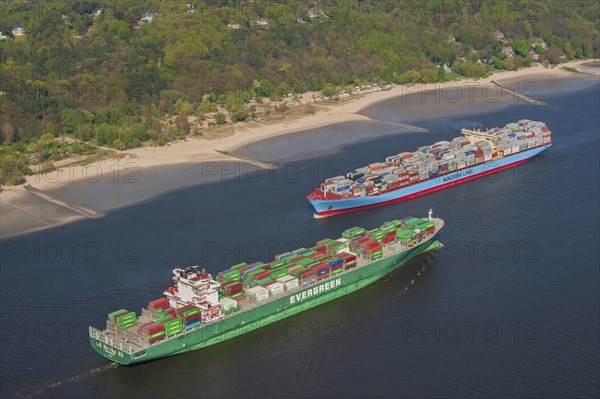 Aerial view of two container ships in the meeting box of the Elbe at the Falkenstein bank