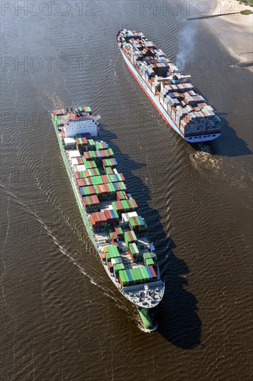 Aerial view of two container ships in the meeting box of the Elbe at the Falkenstein bank