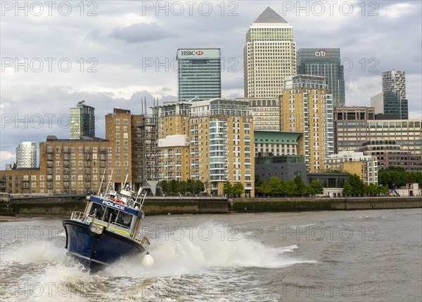 Metropolitan police speedboat motor launch travelling at high speed